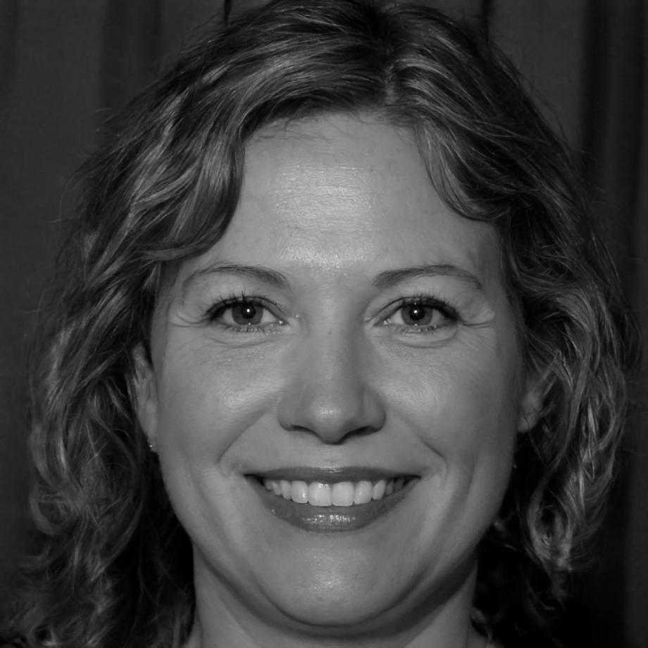 Sarah Whitmore, Senior Financial Analyst, reviewing market reports