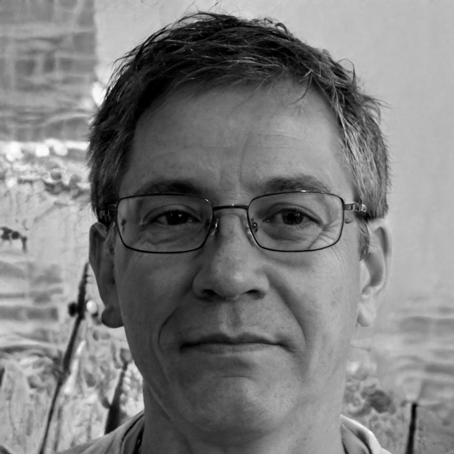 Professional headshot of experienced financial reporting instructor in business attire